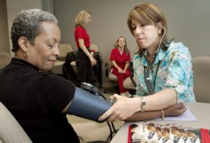 Connie Alfred (left), of the National Center for Infectious Diseases (NCID), was shown having her blood pressure taken by Robyn Morgan, of the National Center for Chronic Disease Prevention and Health Promotion