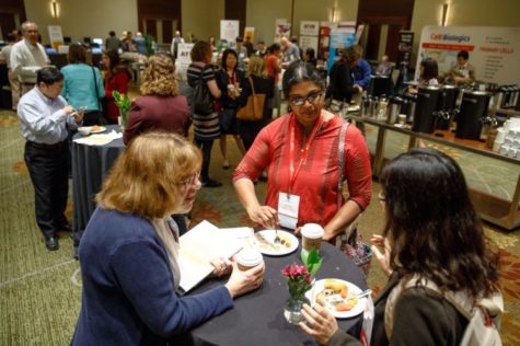 Attendees use the networking opportunities during the breakfast and registration at ATVB 2017