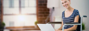 Lady in wheelchair using a laptop.